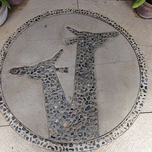 Logo mosaic in front of shop