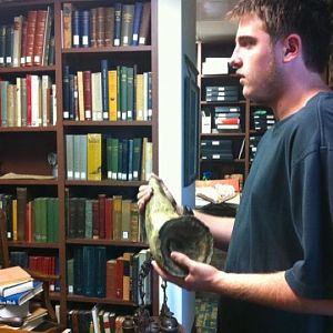 Myself holding black rhino horn in zoo archives