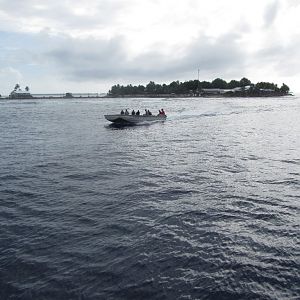 Barge on its way out to meet the boat