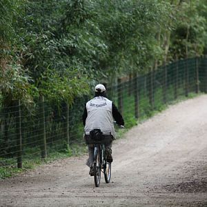 zoo worker on bicycle