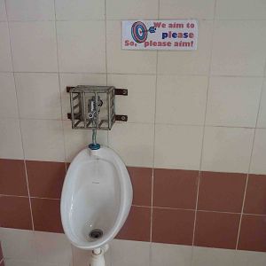 Urinal (where men pee) + sign, May 2013.