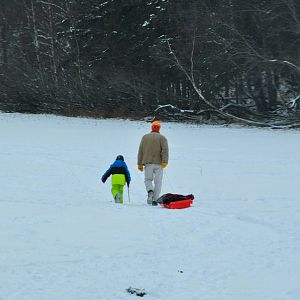 A Boy and his Dad going Ice Fishing - Alaska