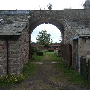 Arch way into walled garden