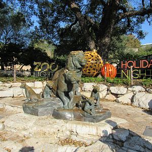 Lion Statures with Holiday Decorations in the background