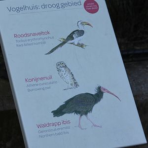 Bird sign outside aviary arid area