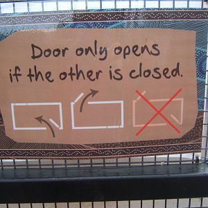 Sign explaining how interlocking doors work