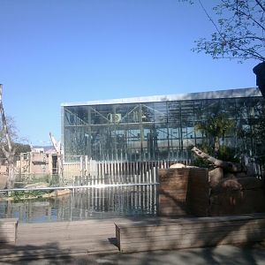 Part of building for elephants with hippo exhibit in front