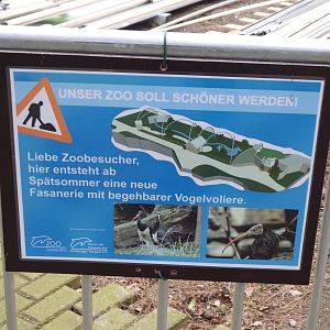 Signage discussing upcoming bird house development