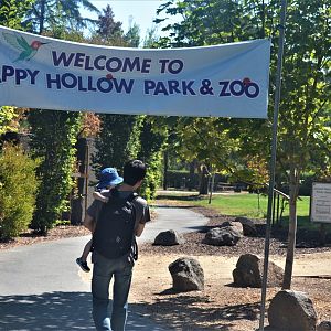 Banner and Pathway Leading From Parking Lot To Zoo