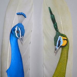 Peacocks painted on feathers