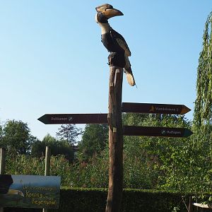Great hornbill-carving on top of road sign post (Sep 2nd, 2018)