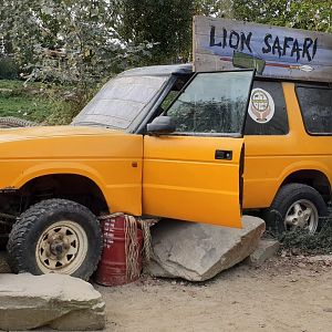 Car near Lion-enclosure