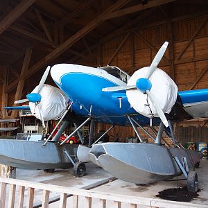The Land of the Cold theming - Bush plane with floaters in the Golden Eagle Aviation hangar, 2019-10-04