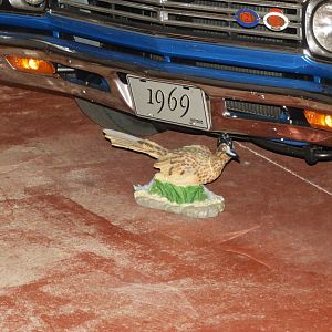 Random Roadrunner Statue underneath Car