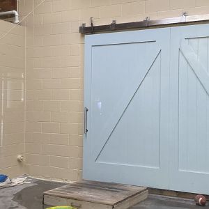 Aquatics building- new shifting door in renovated harbor seal “quarantine pool”