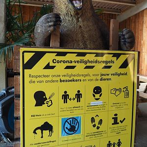 Large standing bear statue with Covid-19 satety rules signage, 2020-09-12