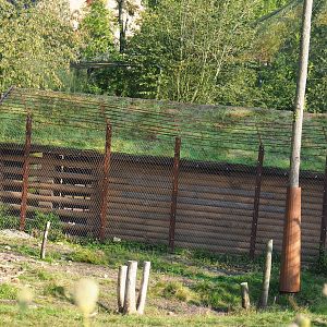 New barn between The Last Frontier and the raptor aviaries, seen across the bear/wolf exhibit, 2021-09-02