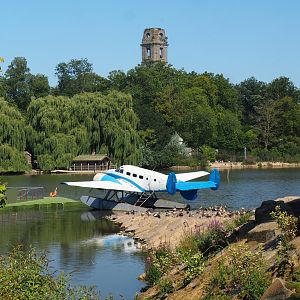 View onto lake with  Beechcraft Model 18 floatplane and old Cambron Abbey tower in the background, 2021-09-03