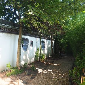 Walkway in The Middle Kingdom along the outer wall of the raccoon dog exhibit with viewing windows, 2021-09-03