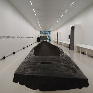 Underground corridor between the entrance building and the museum building, with long dug-out canoe, 2021-10-20