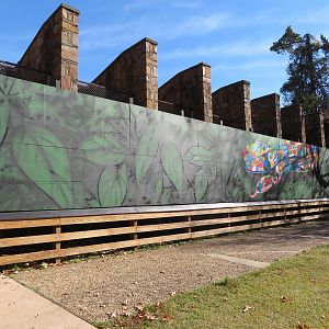 Mural Billboard Blocking Old Primate Enclosures