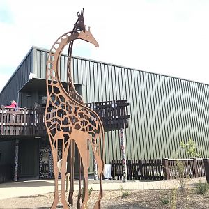 Giraffe house and statue