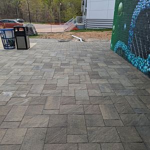 New tiles being installed in the entrance plaza