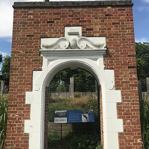 A heron sits on the remains of the 1869 Parrot House