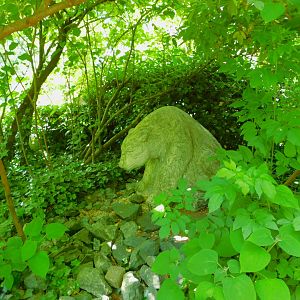 bear (statue) in grove