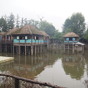 African stilt village inspired by Ganvié in Benin, seen from the train, 2022-09-14