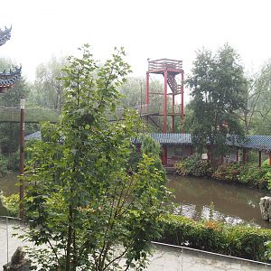 View to lower area from upper otter viewing area with viewing corridor and adventure bridge tower, 2022-09-15