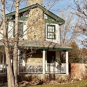 Barn House with Peacock on Porch