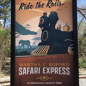 Sign advertising the new train ride at the zoo