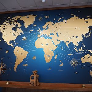 World map behind the resort reception desk, 2023-05-16