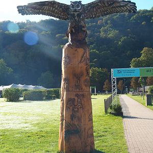 Eagle owl wood carving and carved tree trunk, 2023-09-26