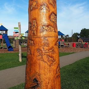 Tree trunk carved with animals and landscapes of the domain, 2023-09-26