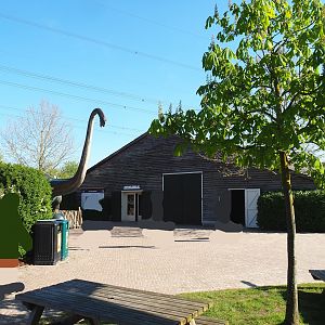 Barn with indoor playground and terrarium room, and Brachiosaurus statue, 2023-04-30