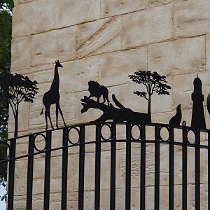 Entrance gate with metal cut-outs representing Pairi Daiza's worlds, 2024-09-17