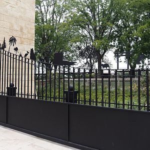 Entrance gate with metal cut-outs representing Pairi Daiza's worlds, 2024-09-17