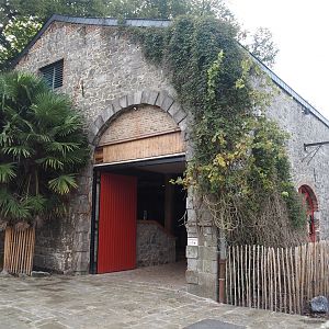 Former main gift shop building, now housing farm animal stables, 2024-09-17