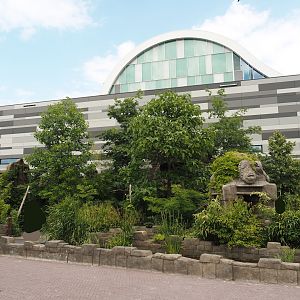 Monkey Ruins exhibit next to entrance building and entrance square, 2024-06-23