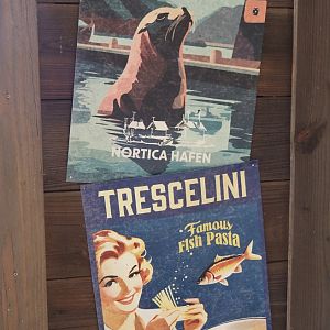 Nortica Hafên port themed area - Examples of fake advertisements in former sea lion theater, 2024-06-23