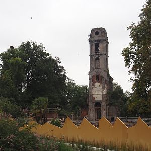 Golden egg shell wall of "Egg of the World' entrance area and old abbey tower, 2024-09-17