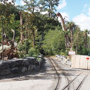 Prehi Daiza: Lands of the Past - Land of the Giants - Area with dinosaur animatronic models surrounding train track, 2025-09-01