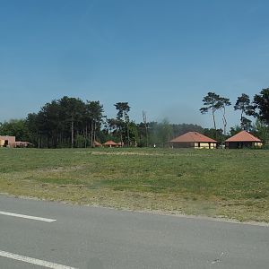 Car safari - Giraffe plains, with Safari resort bungalows in the background, 2025-04-30