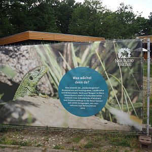 Construction fence signage about the nature exploration garden with outdoor native herp terrariums being constructed, 2025-05-22