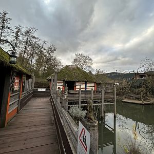 Stilt village with pygmy hippopotamus enclosure