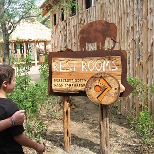 Giants of the Savanna: Restroom sign