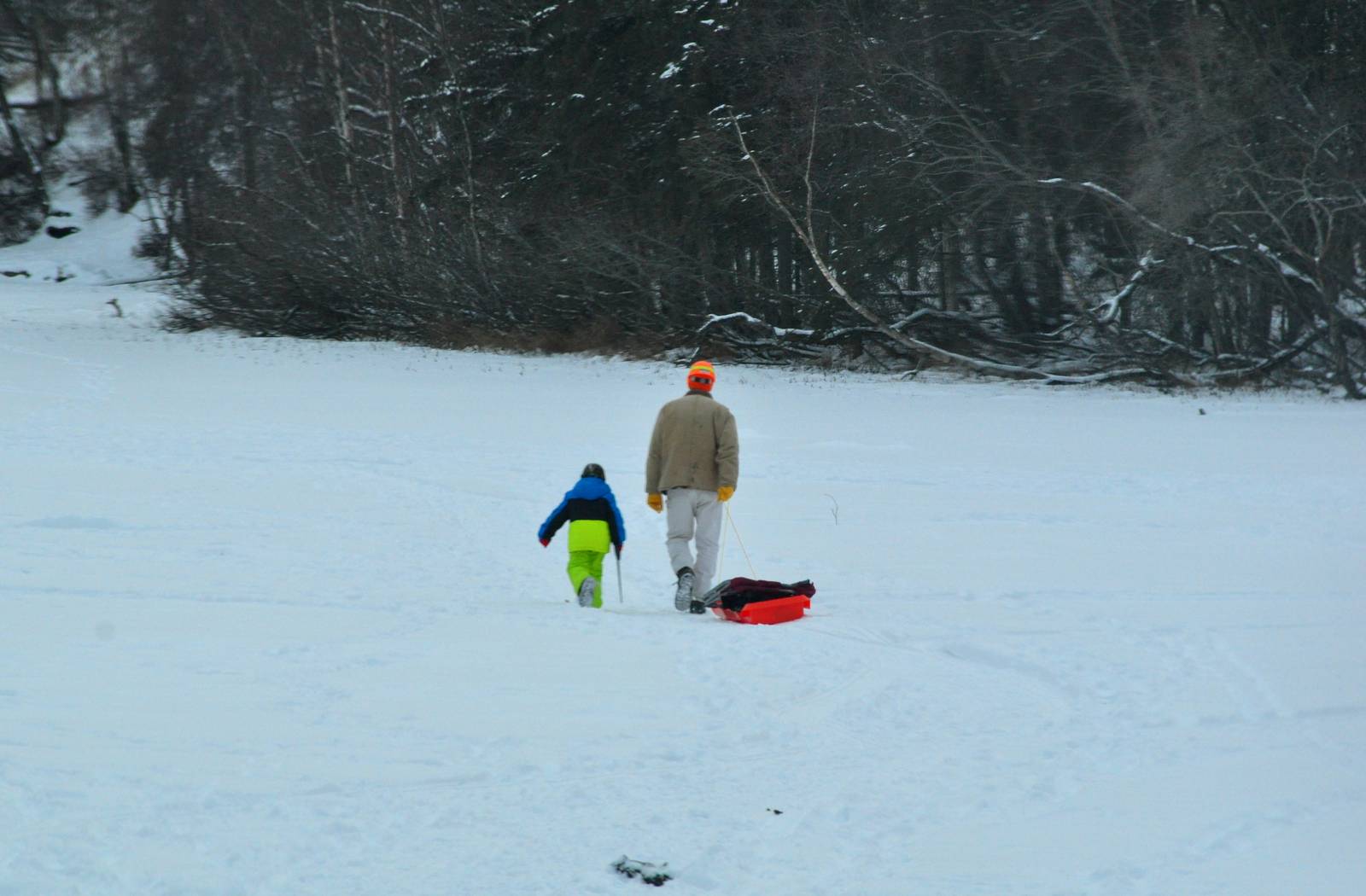 A Boy and his Dad going Ice Fishing - Alaska