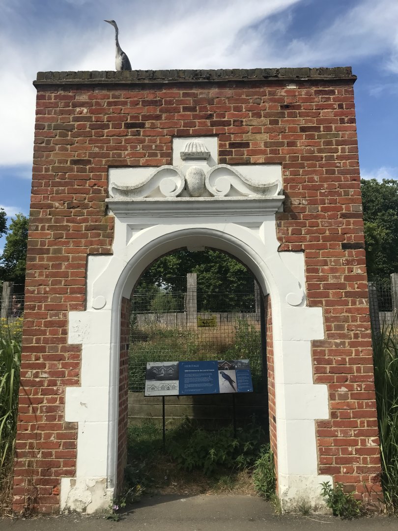 A heron sits on the remains of the 1869 Parrot House
